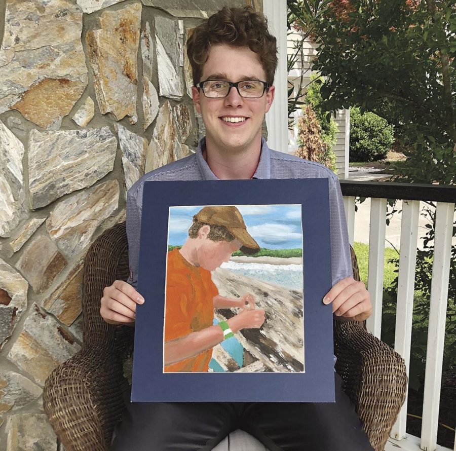 Senior+Dawson+Bell+holds+his+photo+of+the+Surfside+Pier+that+will+be+displayed+in+the+U.S.+Capitol.