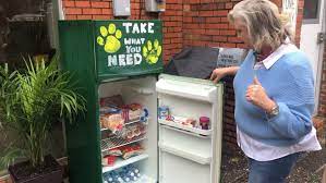 Teacher Mrs. Patricia Jones inspects one of the refrigerators she set up with her pastor in Conway to help those in need during the Pandemic.