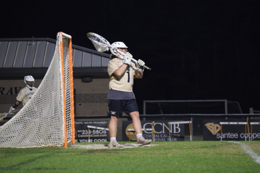 Senior Ryan Weeks guards the goal in a home game against Wando. The Braves went on to lose 21-2.