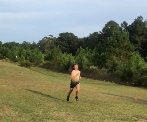 Hayden Marks runs in a cross country race against Carolina Forest.