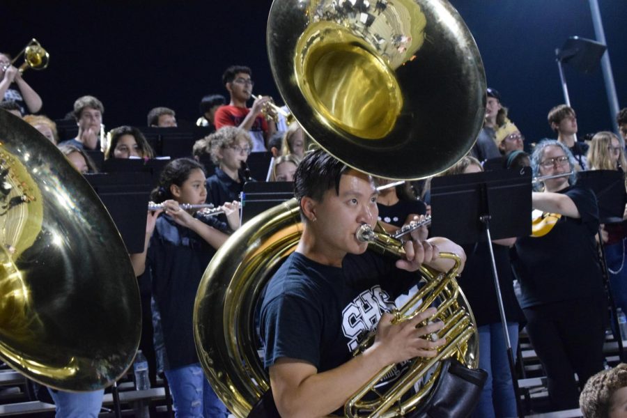 Hands-on Band Director Mr. Jung fills in as a tuba player during a football game.