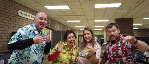Mr. Hampton Campbell, Mrs. Jacqueline Sautoff, Ms. Rachel Gray, and Mr. Sam Hanks dress up for Tropical Thursday during a Countdown to Spring Break Spirit Week.