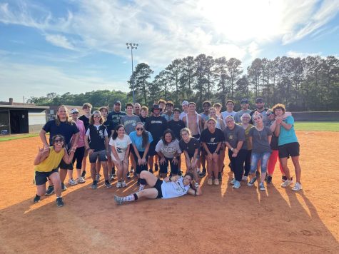 Students and staff who participated in the 2nd Annual Kickball Game pose for a picture afterward.