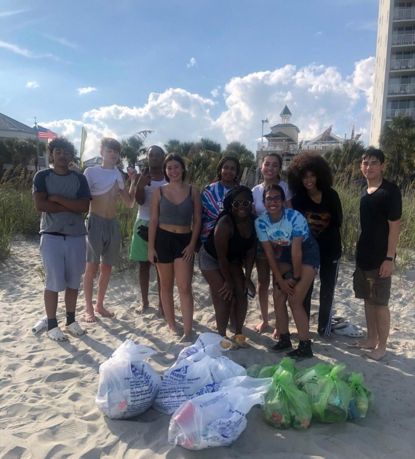 Ocean+Club+students+pose+behind+some+of+the+14+bags+of+trash++they+found+at+Springmaid+Pier.
