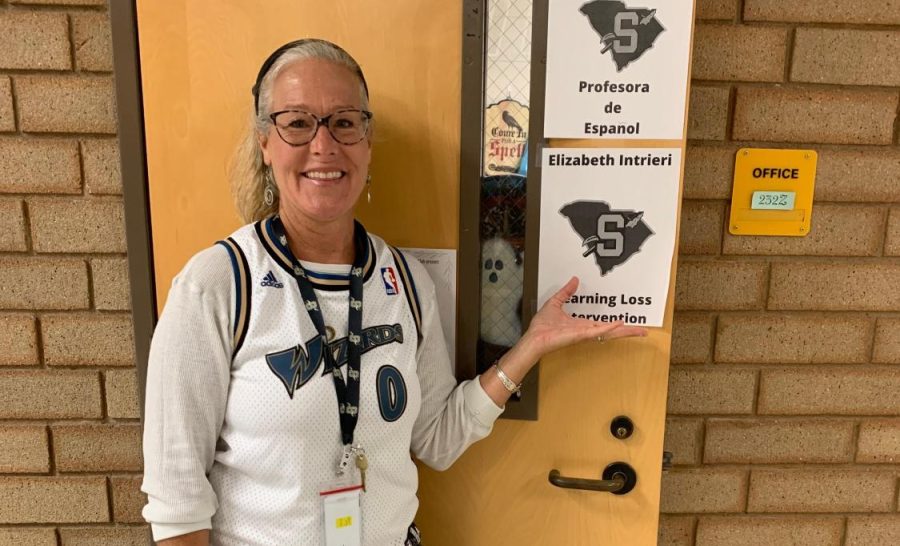 Mrs. Intrieri, the schools new Learning Loss Interventionist, stands by her office door.