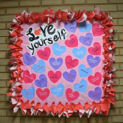 One Love Club members have created several bulletin boards around the school to promote positive relationships.