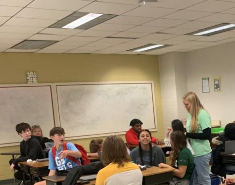 Ms. Renea Urbaniak, a new teacher who came to Socastee right after graduating from Coastal Carolina, talks with her math students.