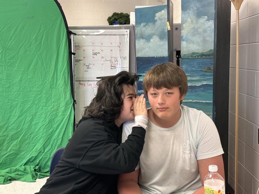Freshmen Gabe Flores and Dale Wickberg whisper during English class. Students often find themselves unintentionally spreading gossip in the classroom.