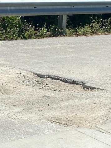 This pot hole in the student parking lot is being paved over.