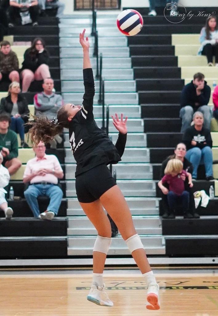 Outside Hitter Sierra Roberts, blocks during a game. The 8th grader is a star on the Womens Volleyball team.