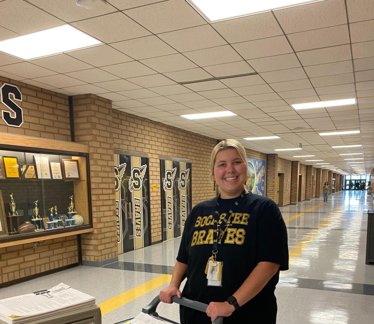 Social Studies Teacher Ms. Kira Hamilton moves to her next class. She is among several new teachers who travel between classrooms with a cart. 