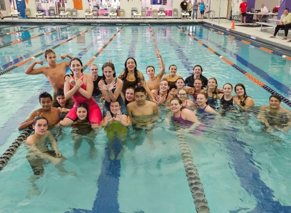 The mens and womens swim teams pose for a photo after the women wone 5A Regionals on Oct. 7 at North Myrtle Beach.
