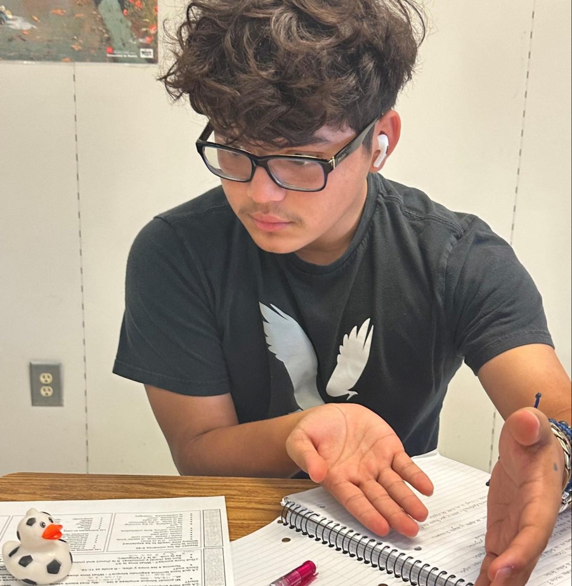 Sergio Molina (11) talks to his rubber duck Pessi about an assignment.