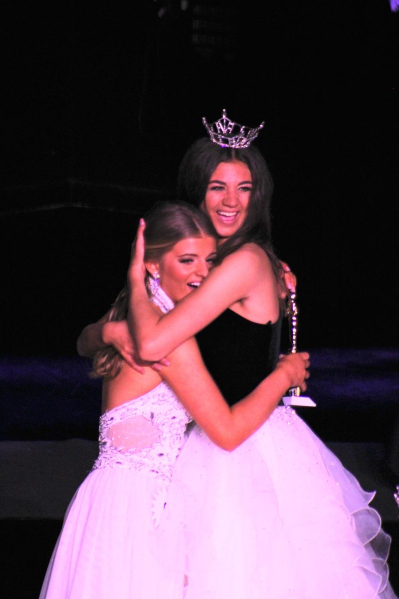 Junior Victoria Byrd is congratulated for winning the Miss Socastee pageant by 2022-23 Miss Socastee Laney Barno.
