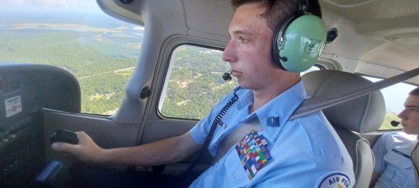 Aiden Wolfrey (12) flies with Tristan Rains (12) as part of the JROTC program. Aiden has been awarded a scholarship to Embry-Riddle University to become a pilot.