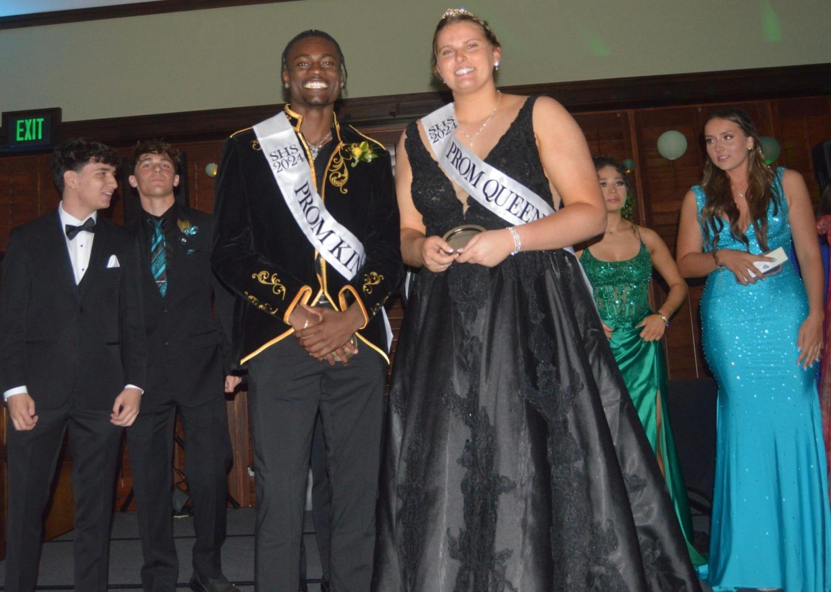 Prom King Quadir Scott and Prom Queen Anna Reese Pratt receive their awards at the dance March 26.
